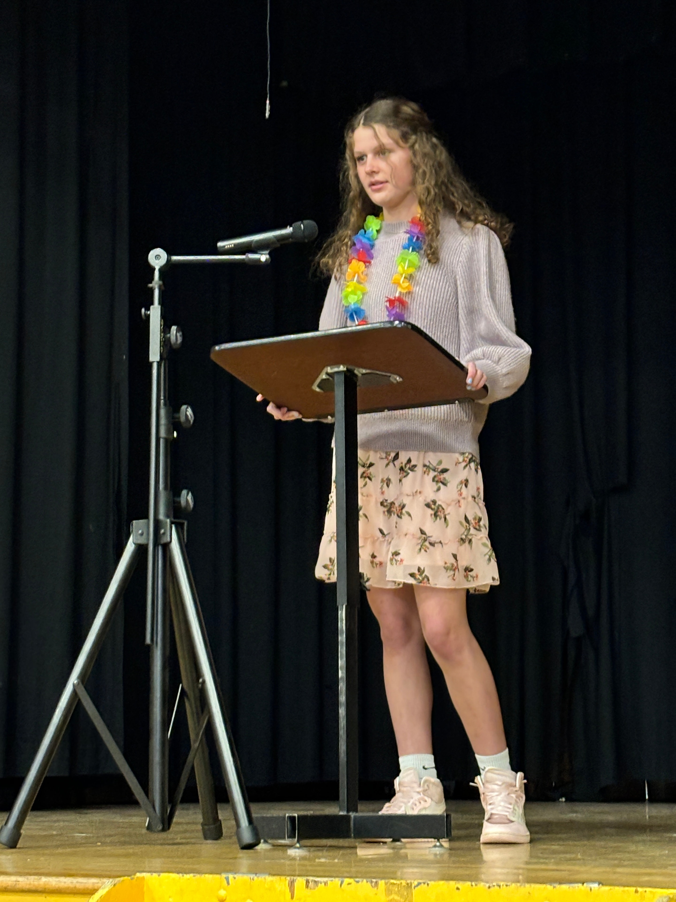Student performing at a Poetry Out Loud competition on stage