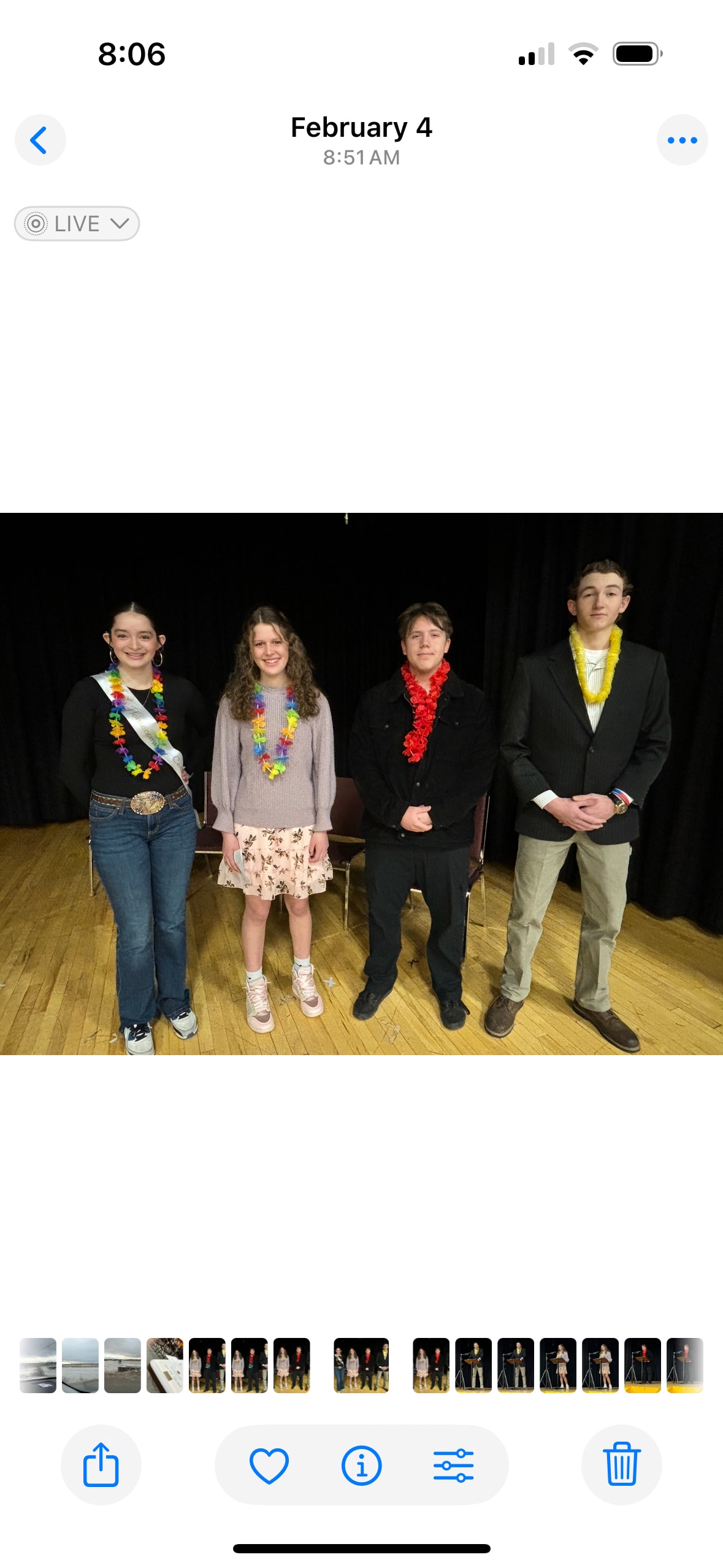 Poetry Out Loud finalists on stage wearing colorful lei